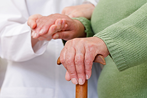 Doctor holding a patient's hand